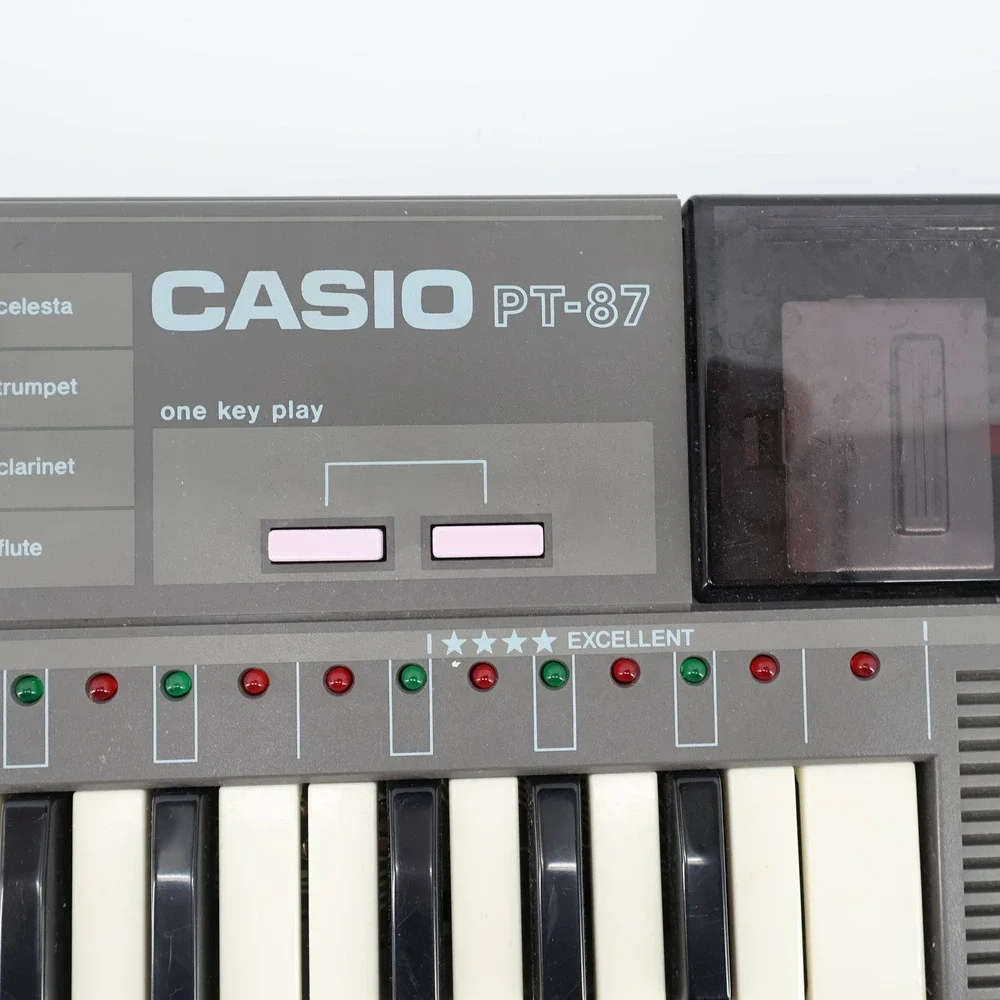 Vintage Casio PT-87 Mini Keyboard & ROM Pack RO-551 World Songs TESTED & WORKING